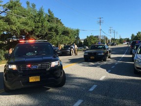 Police and Emergency Medical Services respond to a shooting at a business park in the Edgewood area of Harford County, Md., Wednesday, Oct. 18, 2017. (Matt Button/The Baltimore Sun via AP)