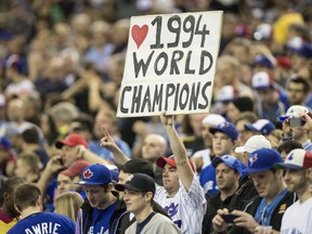 In this March 29, 2014 file photo, a fan shows his appreciation during a ceremony for the 1994 Expos before a Toronto Blue Jays exhibition game in Montreal.