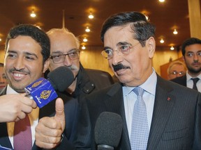 Hamad bin Abdulaziz al-Kawari, Qatar's candidate for the post of the new UNESCO chief gives the a thumb's up as he he speaks to the media after the fourth vote by secret ballot at the UNESCO headquarters in Paris, France, Thursday, Oct. 12, 2017. The United States is pulling out of UNESCO because of what Washington sees as its anti-Israel bias and a need for "fundamental reform" of the U.N. cultural agency. (AP Photo/Michel Euler)