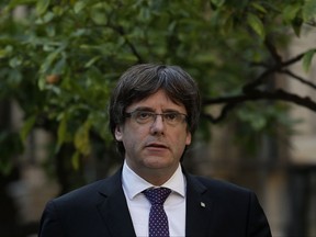 Catalan President Carles Puigdemont arrives for a meeting at the Palau Generalitat in Barcelona, Spain, Tuesday, Oct. 17, 2017.