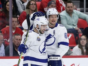 Tampa Bay Lightning center Tyler Johnson (9) celebrates with defenseman Anton Stralman (6) after scoring against the Detroit Red Wings during the first period of an NHL hockey game Monday, Oct. 16, 2017, in Detroit. (AP Photo/Duane Burleson)