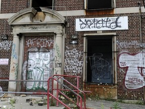 FILE - This Aug. 8, 2012 file photo shows a closed Kronk Recreation Center at 5555 McGraw in Detroit. The fabled Kronk Gym building in Detroit, where boxing champion Thomas Hearns and others trained, has been destroyed by fire. Deputy Fire Chief Dave Fornell told The Detroit News Sunday that the blaze at the vacant building on the city's southwest side was reported about 9:30 p.m. Saturday, Oct. 7, 2017. (Elizabeth Conley/Detroit News via AP)