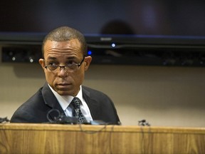 Harvey Hollins, director of urban initiatives for the state of Michigan, testifies on the fourth day of Michigan Health and Human Services Director Nick Lyon's preliminary examination on Friday, Oct. 6, 2017, in Genesee County District Court in Flint, Mich. Lyon faces charges of involuntary manslaughter and misconduct in office for his response to the Flint Water Crisis. His court proceedings have progressed farther than those of other public officials facing criminal charges in connection to the crisis. Lyon's exam was conducted in front of Judge David J. Goggins. (Terray Sylvester /The Flint Journal-MLive.com via AP)
