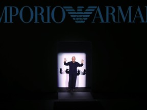 FILE - In this Jan. 14, 2017 file photo, Italian fashion designer Giorgio Armani acknowledges the applause after presenting his Emporio Armani men's Fall-Winter 2017-2018 collection, part of the Milan Fashion Week, unveiled in Milan, Italy. In an interview with Corriere della Sera published Monday, Oct. 23, 2017, Armani broke the silence, saying that after he dies, three people that he names will be put in charge of the foundation that he created last year as a succession tool.  (AP Photo/Antonio Calanni, files)
