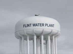 FILE - In this Feb. 26, 2016, file photo, the Flint Water Plant tower stands in Flint, Mich. The City Council voted Monday, Oct. 23, 2017, to extend a short-term contract for drinking water after requesting more time to comply with a federal judge's order to choose a long-term water source. (AP Photo/Paul Sancya, File)