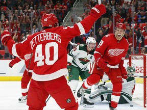 Detroit Red Wings' Anthony Mantha (39) celebrates his goal with Henrik Zetterberg, of Sweden (40) against the Minnesota Wild in the second period of an NHL hockey game Thursday, Oct. 5, 2017, in Detroit. (AP Photo/Paul Sancya)