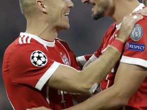 Bayern's Mats Hummels, right, celebrates his goal with Bayern's Arjen Robben during a Group B Champions League soccer match between Bayern Munich and Celtic F.C. at the Allianz Arena in Munich, Germany, Wednesday, Oct. 18, 2017. (AP Photo/Matthias Schrader)