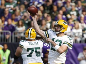 Green Bay Packers quarterback Aaron Rodgers (12) throws against the Minnesota Vikings in the first half of an NFL football game in Minneapolis, Sunday, Oct. 15, 2017. (AP Photo/Bruce Kluckhohn)