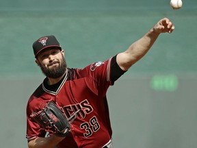 Arizona Diamondbacks starting pitcher Robbie Ray throws during the first inning of a baseball game against the Kansas City Royals, Sunday, Oct. 1, 2017, in Kansas City, Mo. (AP Photo/Charlie Riedel)