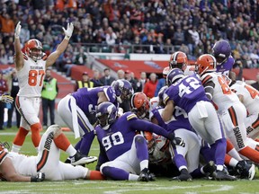 Cleveland Browns quarterback DeShone Kizer (7) scores on a 1-yard touchdown run during the first half of an NFL football game against Minnesota Vikings at Twickenham Stadium in London, Sunday Oct. 29, 2017. (AP Photo/Matt Dunham)