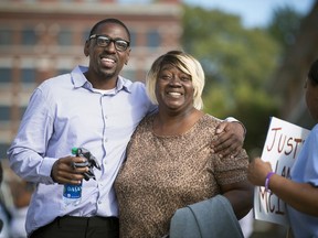 FILE - In this Oct. 13, 2017, file photo, Lamonte McIntyre, who was imprisoned for 23 years for a 1994 double murder in Kansas that he always said he didn't commit, walks out of a courthouse in Kansas City, Kan., with his mother, Rosie McIntyre, after the district attorney dropped the charges. Kansas legislators expect to consider proposals next year to make it easier for people wrongly convicted of major crimes to win compensation from the state. (Tammy Ljungblad /The Kansas City Star via AP, File)