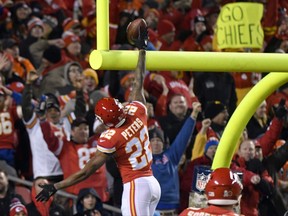 Kansas City Chiefs defensive back Marcus Peters (22) celebrates his touchdown after he stripped the ball from Denver Broncos running back Jamaal Charles (28), during the first half of an NFL football game in Kansas City, Mo., Monday, Oct. 30, 2017. Peters recovered the ball and ran for a touchdown. (AP Photo/Ed Zurga)
