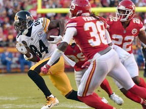 Pittsburgh Steelers wide receiver Antonio Brown (84) runs away from Kansas City Chiefs defensive back Ron Parker (38), Kansas City Chiefs cornerback Terrance Mitchell (39) and defensive back Marcus Peters (22) during the first half of an NFL football game in Kansas City, Mo., Sunday, Oct. 15, 2017. (AP Photo/Ed Zurga)