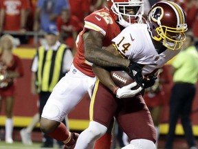 Washington Redskins wide receiver Ryan Grant (14) scores a touchdown against Kansas City Chiefs defensive back Marcus Peters (22) during the second half of an NFL football game in Kansas City, Mo., Monday, Oct. 2, 2017. (AP Photo/Charlie Riedel)