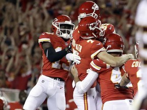 Kansas City Chiefs players celebrate with kicker Harrison Butker (7) after he kicked the go-ahead field goal late in the fourth quarter of an NFL football game against the Washington Redskins in Kansas City, Mo., Monday, Oct. 2, 2017. The Chiefs won 29-20. (AP Photo/Charlie Riedel)