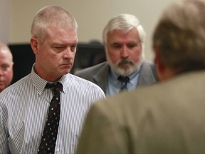 FILE - In this March 26, 2014, file photo, Craig Michael Wood, left, enters the courtroom for a hearing in Springfield, Mo. Wood is charged with first-degree murder, armed criminal action, child kidnapping, rape and sodomy in connection with 10-year-old Hailey Owens' death in February of 2014. Opening statements are set for Monday, Oct. 30, 2017. (Nathan Papes/The Springfield News-Leader via AP, Pool, File)