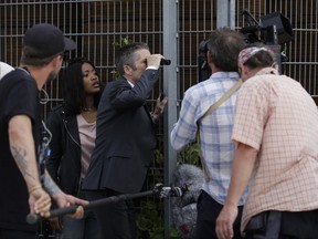 In this photo taken on Wednesday, June 28, 2017, actors Keke Palmer, second from left, and Leland Orser, center, perform at the set for an episode of Epix's "Berlin Station" TV series in Berlin. (AP Photo/Markus Schreiber)