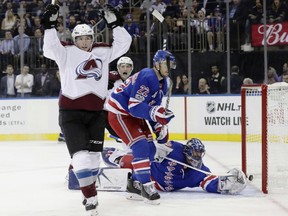 Colorado Avalanche's Matt Duchene, left, celebrates after scoring a goal on New York Rangers goalie Henrik Lundqvist, of Sweden, right, during the first period of an NHL hockey game Thursday, Oct. 5, 2017, in New York. (AP Photo/Frank Franklin II)