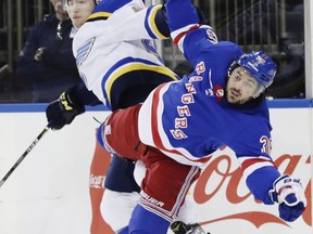 St. Louis Blues' Ivan Barbashev, left, and New York Rangers' Mats Zuccarello, right, fight for position during the first period of an NHL hockey game Tuesday, Oct. 10, 2017, in New York. (AP Photo/Frank Franklin II)