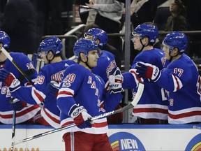 New York Rangers' Chris Kreider (20) celebrates with teammates after scoring a goal during the first period of an NHL hockey game against the Arizona Coyotes Thursday, Oct. 26, 2017, in New York. (AP Photo/Frank Franklin II)