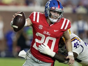 Mississippi quarterback Shea Patterson (20) is sacked by LSU linebacker Arden Key (49) in the second half of an NCAA college football game in Oxford, Miss., Saturday, Oct. 21, 2017. No. 24 LSU won 40-24. (AP Photo/Rogelio V. Solis)