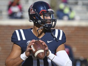 Mississippi quarterback Jordan Ta'amu (10) warms up before an NCAA college football game between Mississippi and Arkansas in Oxford, Miss., Saturday, Oct. 28, 2017. (AP Photo/Thomas Graning)
