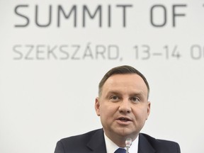 President of Poland Andrzej Duda speaks during a joint press conference of the heads of state of the Visegrad Group (V4) countries following their meeting in Szekszard, 143 kms south of Budapest, Hungary, Saturday, Oct. 14, 2017, on the second day of the two-day summit. (Tamas Kovacs/MTI via AP)