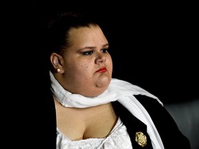 Uruguayan Sen. Michelle Suarez waits to speak with reporters after taking an oath of office, in Montevideo, Uruguay, Tuesday, Oct. 10, 2017. Promising to bolster gender equality rights in Uruguay, Suarez is the first transgender elected to the legislative body in the history of the South American country. As an activist she helped to draft the country's marriage equality law. (AP Photo/Matilde Campodonico)