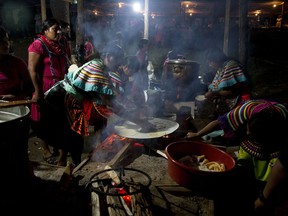 In this Saturday, Oct. 14, 2017 photo, women cook tortillas at the end of a campaign rally for Maria de Jesus Patricio, presidential candidate for the National Indigenous Congress, in the Zapatista stronghold of Guadalupe Tepeyac in the southern state of Chiapas, Mexico. Patricio is running a grass-roots campaign in a country where politics has always been dominated by big-spending, corrupt politicians. (AP Photo/Eduardo Verdugo)
