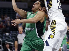 Maccabi Haifa's Ángel Rodríguez (3) is fouled by Indiana Pacers forward Myles Turner (33) during the first half of an NBA exhibition basketball game in Indianapolis, Tuesday, Oct. 10, 2017. (AP Photo/Michael Conroy)