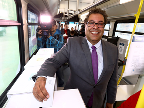 Calgary Mayor Naheed Nenshi votes at an advance polling station set up on a transit bus in downtown Calgary on Tuesday.