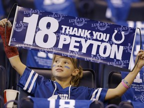 A fan holds up a sign before an NFL football game between the Indianapolis Colts and the San Francisco 49ers, Sunday, Oct. 8, 2017, in Indianapolis. (AP Photo/Michael Conroy)