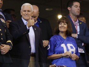 Vice President Mike Pence reacts to fans before an NFL football game between the Indianapolis Colts and the San Francisco 49ers, Sunday, Oct. 8, 2017, in Indianapolis. (AP Photo/Michael Conroy)