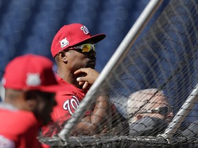 Washington Nationals' assistant hitting coach Jacque Jones watches batting practice during a baseball workout at Nationals Park, Wednesday, Oct. 4, 2017, in Washington. The Nationals host the Chicago Cubs in Game 1 of the National League Division Series on Friday. (AP Photo/Mark Tenally)