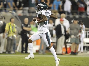 Philadelphia Eagles' Jalen Mills (31) celebrates his interception of a Carolina Panthers pass in the second half of an NFL football game in Charlotte, N.C., Thursday, Oct. 12, 2017. (AP Photo/Mike McCarn)