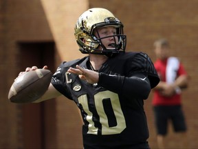 Wake Forest's John Wolford (10) looks to pass against Louisville during the first half of an NCAA college football game in Winston-Salem, N.C., Saturday, Oct. 28, 2017. (AP Photo/Chuck Burton)