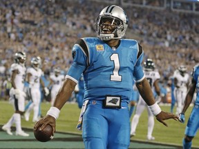 Carolina Panthers' Cam Newton (1) celebrates his touchdown run against the Philadelphia Eagles in the first half of an NFL football game in Charlotte, N.C., Thursday, Oct. 12, 2017. (AP Photo/Bob Leverone)