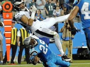 Philadelphia Eagles' Zach Ertz (86) catches a touchdown pass as Carolina Panthers' Mike Adams (29) defends in the second half of an NFL football game in Charlotte, N.C., Thursday, Oct. 12, 2017. (AP Photo/Mike McCarn)