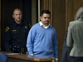 This Feb. 10, 2014, photo shows Juan Carlos Rodriguez entering the courtroom in Winston Salem, N.C.  North Carolina's highest court is reviewing whether justice means the death penalty for a survivor of El Salvador's blood-soaked civil war of the 1980s who strangled and then decapitated his estranged wife. The state's Supreme Court hears oral arguments Monday, Oct. 9, 2017, on whether the state can execute Rodriguez for the 2010 murder of his wife, Maria. (Lauren Carroll/Winston-Salem Journal via AP)