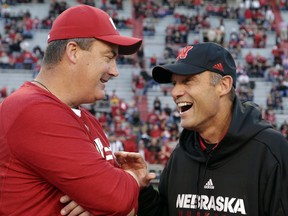 Nebraska head coach Mike Riley, right, chats with Wisconsin head coach Paul Chryst before an NCAA college football game in Lincoln, Neb., Saturday, Oct. 7, 2017. (AP Photo/Nati Harnik)