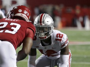 File-This Sept. 30, 2017, file photo shows Ohio State corner back Denzel Ward (12) lining up against Rutgers wide receiver Dacoven Bailey (23) during an NCAA college football game in Piscataway, N.J. (AP Photo/Mel Evans, File)