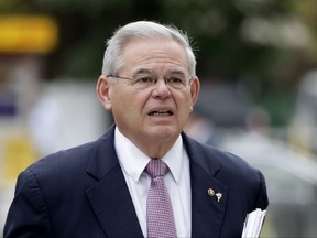 U.S. Sen. Bob Menendez arrives at the Martin Luther King, Jr., Federal Courthouse for his federal corruption trial, Thursday, Oct. 26, 2017, in Newark, N.J. (AP Photo/Julio Cortez)