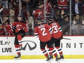 New Jersey Devils right wing Jimmy Hayes (10) celebrates his goal against the Ottawa Senators during the first period of an NHL hockey game, Friday, Oct. 27, 2017, in Newark, N.J. (AP Photo/Julio Cortez)