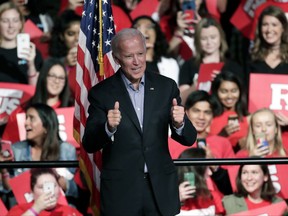 Former Vice President Joe Biden acknowledges students as he is introduced on stage before delivering remarks regarding sexual violence on college campuses during a visit to Rutgers University, Thursday, Oct. 12, 2017, in New Brunswick, N.J. (AP Photo/Julio Cortez)