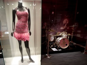 In this Oct. 10, 2017, photo, a Roberto Cavalli dress worn by Beyonce during a performance with Prince at the 2004 Grammy awards show, is displayed at the Grammy Museum Experience at Prudential Center in Newark, N.J. The museum is scheduled to open to the public on Oct. 19. (AP Photo/Julio Cortez)