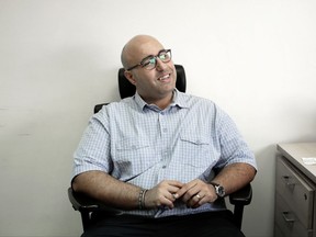 Mohamed Zaree, human rights advocate and legal scholar, smiles during an interview with The Associated Press in Cairo, Egypt, Tuesday, Oct. 10, 2017. Ten of the world's leading human rights organizations have selected Zaree for the prestigious Martin Ennals award, given in recognition of outstanding work at great personal risk. But Zaree could not attend the ceremony in Geneva because the Egyptian government has accused him of harming national security and has placed him on a no-fly list. (AP Photo/Nariman El-Mofty)