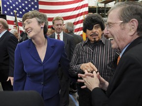 File - In this March 7, 2011, file photo, Al Hurricane, center, looks on as former New Mexico Senator Pete Domenici, right, joins former U.S. Rep. Heather Wilson, R-N.M., left, at an event in Albuquerque, N.M. Hurricane, known as the "Godfather of New Mexico music" for developing a distinct sound bridging the state's unique Hispanic traditions with country and rock, has died. Hurricane died Sunday, Oct. 22, 2017, from complications related to prostate cancer. He was 81. (Pat Vasquez-Cunningham/The Albuquerque Journal via AP)