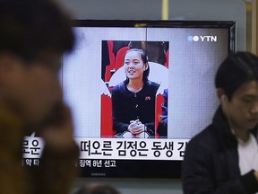 In this Nov. 27, 2014, file photo, an image of North Korean leader Kim Jong Un's younger sister Kim Yo Jong is shown on a screen broadcasting a TV news program at Seoul Railway Station in Seoul, South Korea. Kim Jong Un has promoted his younger sister to a new post within North Korea's ruling party. The promotion of Kim Yo Jong came at a meeting of the party as North Korea marked the 20th anniversary of the late Kim Jong Il's acceptance of the title of general secretary of the ruling Worker's Party of Korea. The letters read: "Kim Jong Un's sister."