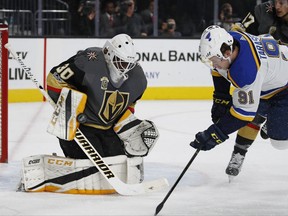 Vegas Golden Knights goalie Malcolm Subban blocks a shot as St. Louis Blues right wing Vladimir Tarasenko (91) is knocked to the ice during the first period of an NHL hockey game Saturday, Oct. 21, 2017, in Las Vegas. (AP Photo/John Locher)