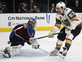 Vegas Golden Knights left wing David Perron, right, scores against Colorado Avalanche goalie Semyon Varlamov during the second period of an NHL hockey game Friday, Oct. 27, 2017, in Las Vegas. (AP Photo/John Locher)